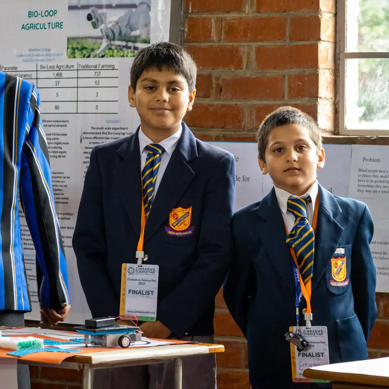Two Westridge pupils in blazers at the Zimbabwe Science Fair